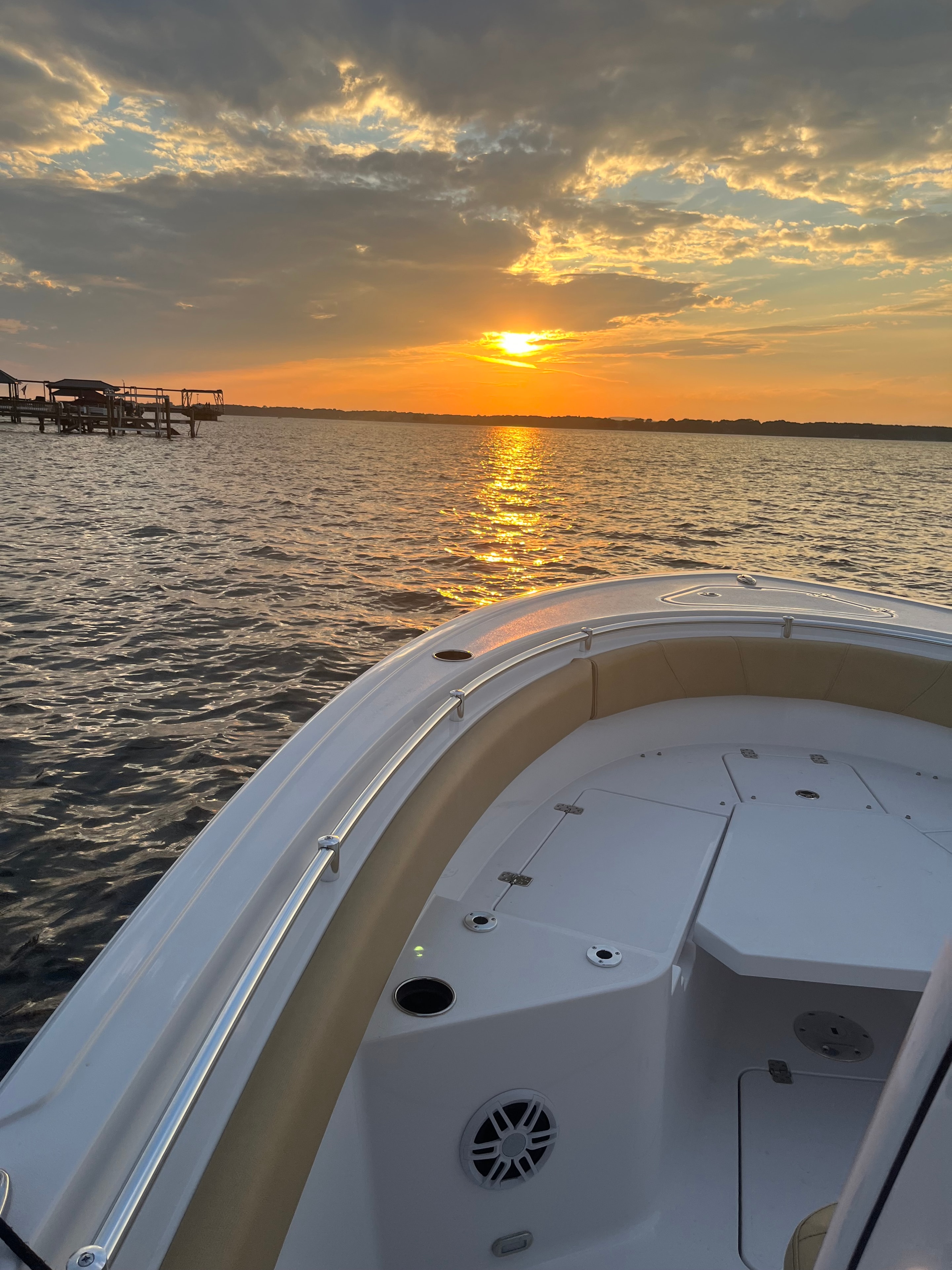 Sportsman 231 bow with sunrise breaking over open Lake Norman water